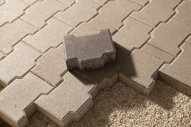 Building an pedestrian path with paver bricks. Sidewalk pavement